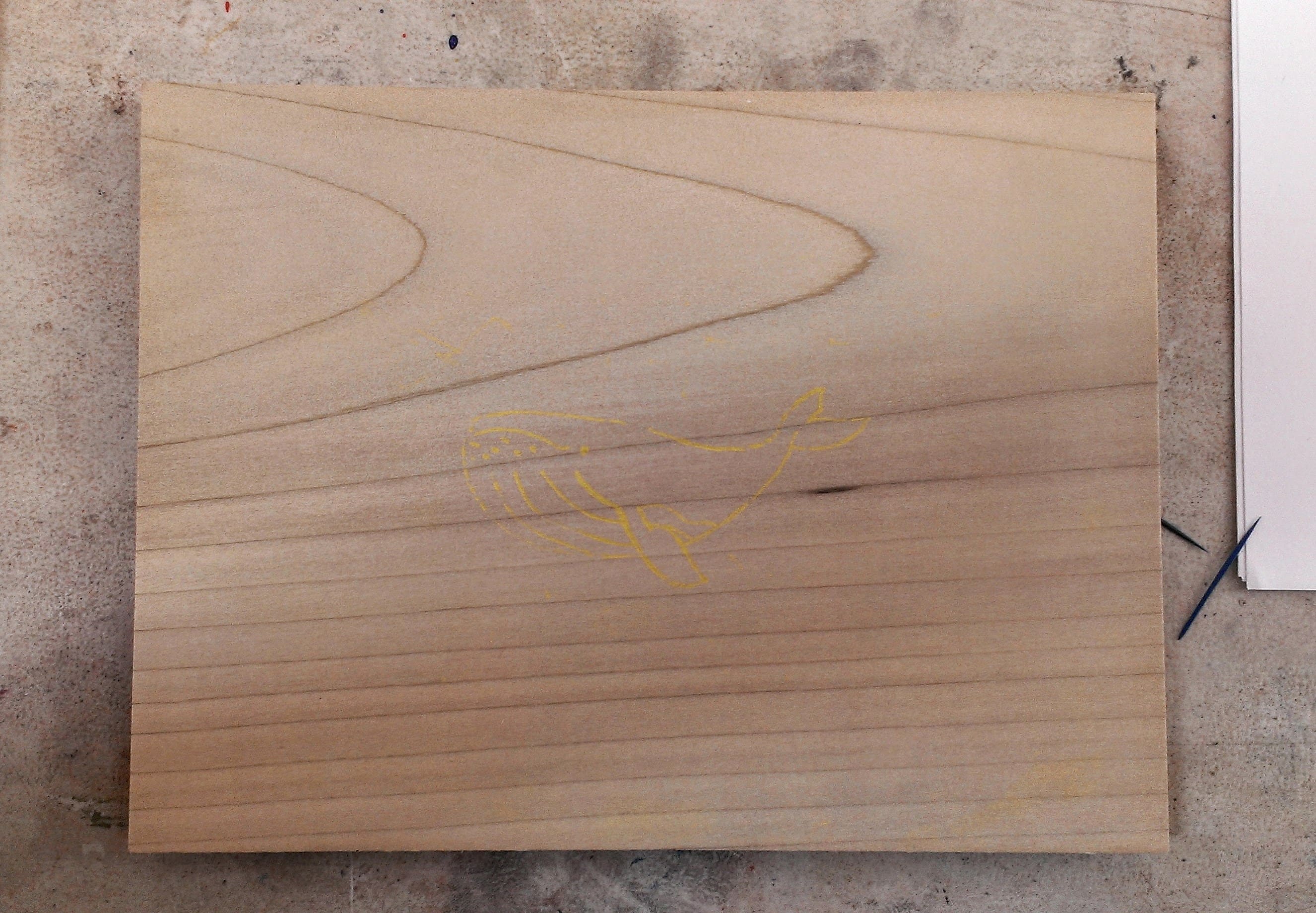 Wood block with design in crayon