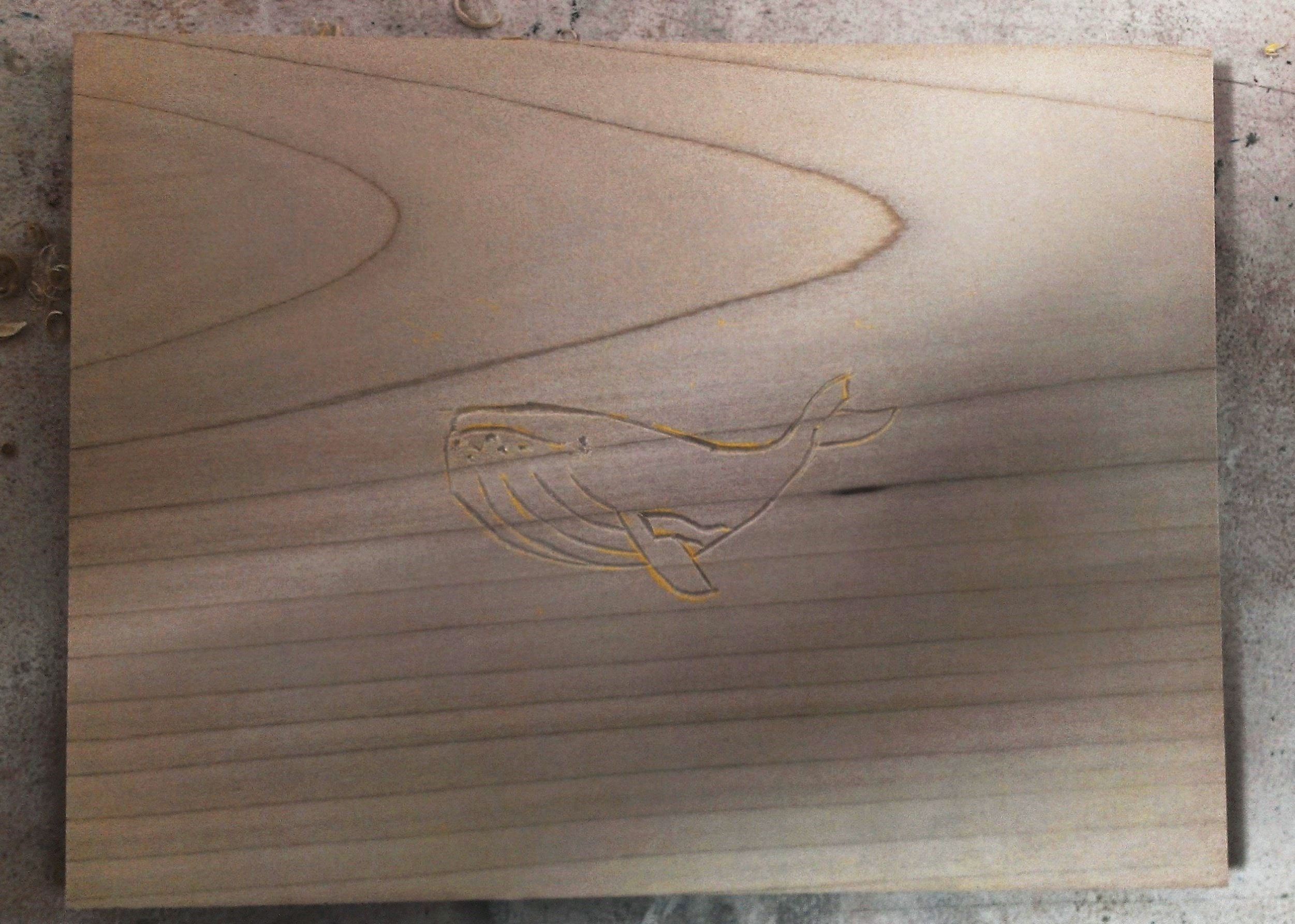 Wood block with design in crayon